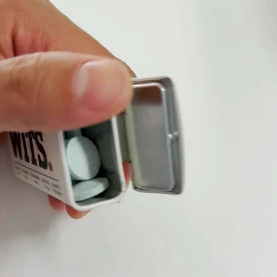 WITS tin opening and pouring peppermint mints